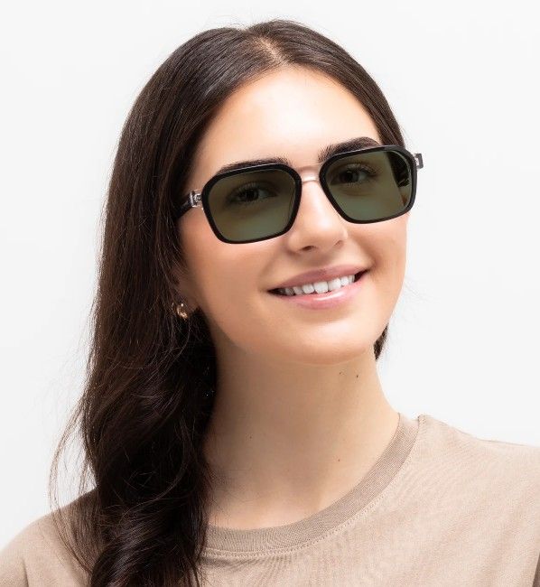 woman wearing Haya aviator sunglasses with green lenses on a white background