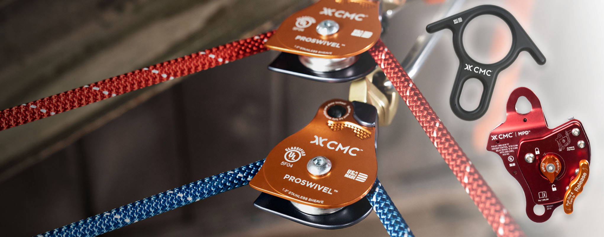 Climbing gear featuring pulleys and ropes in red and blue.