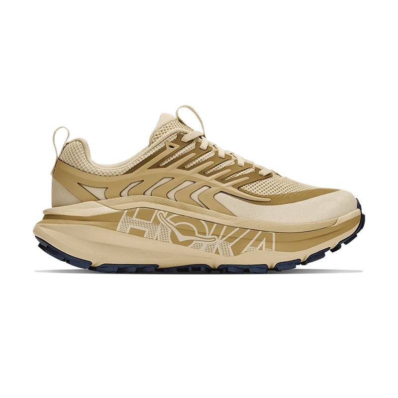 Beige athletic shoes with a sleek design and textured sole.