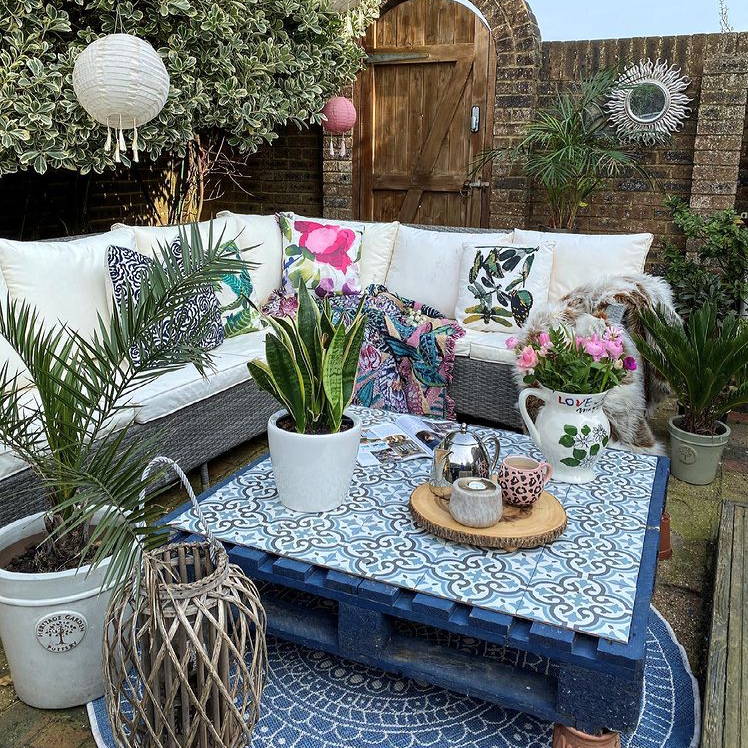 Customer photo of their garden featuring lanterns