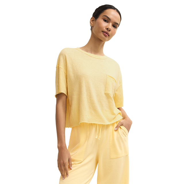 Model wearing a yellow oversized t-shirt and matching pants.
