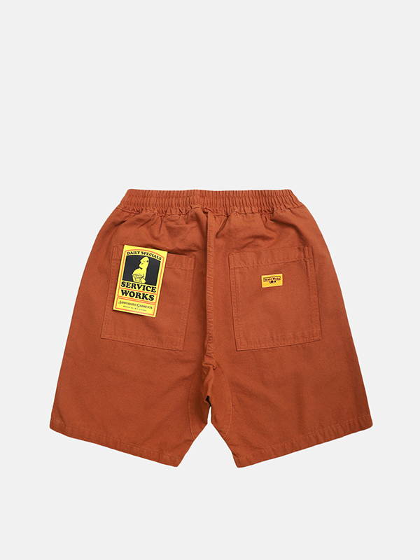 A pair of Service Works Canvas Chef Shorts in Terracotta.