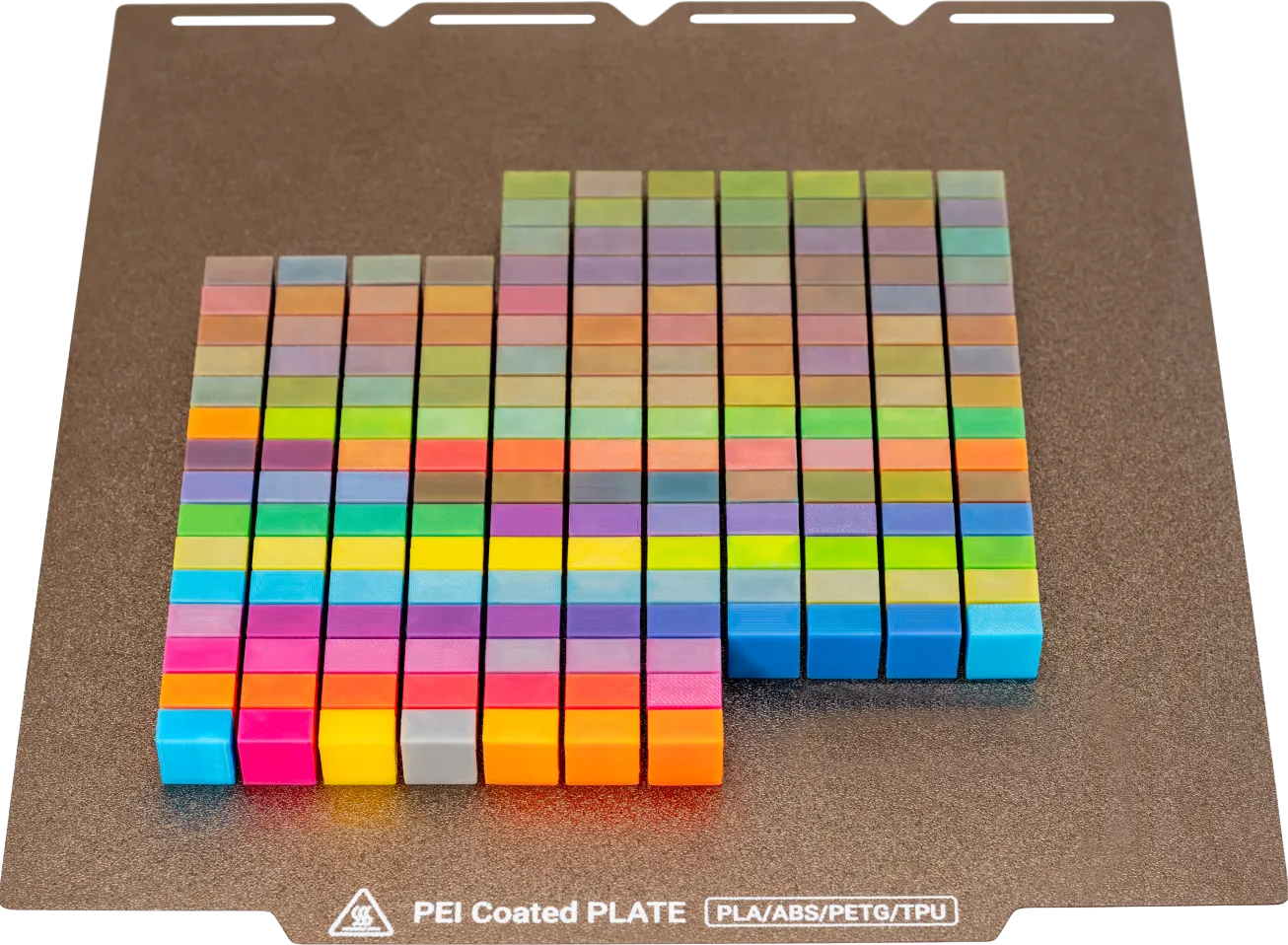 Colorful stacked blocks arranged in a grid pattern on a dark surface.