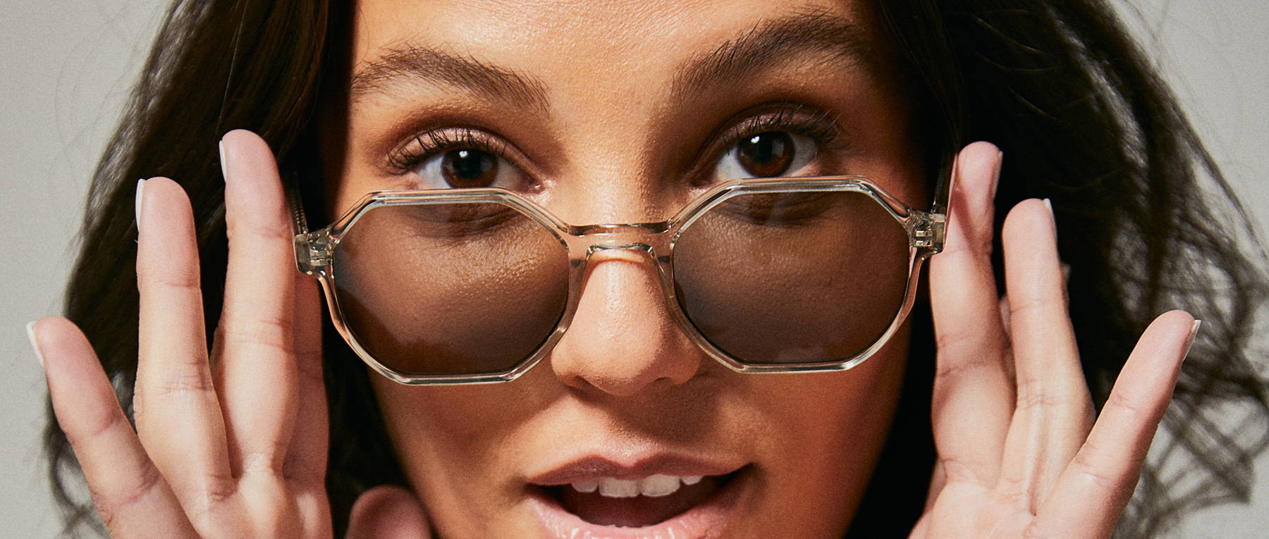 Female model wearing polarised sunglasses from Ozeano Vision