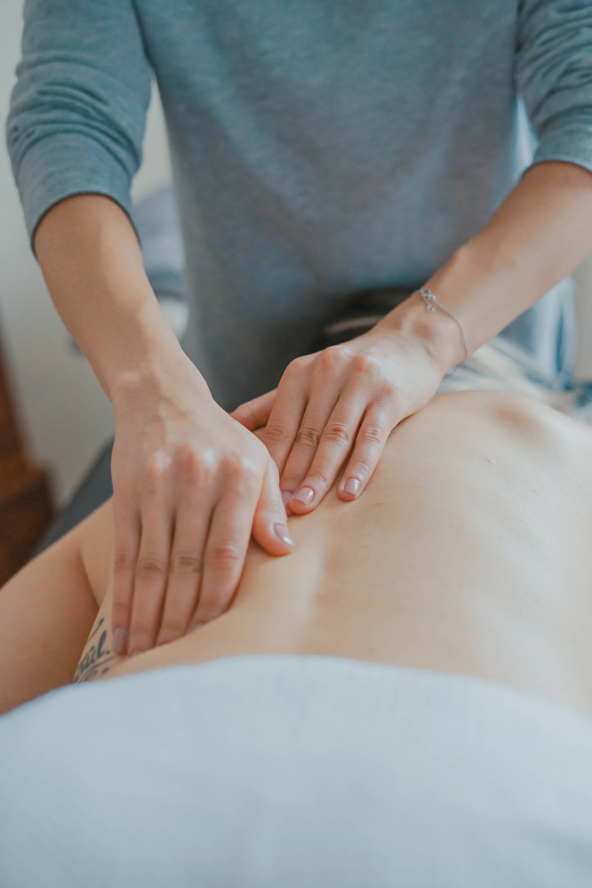 woman massaging another woman