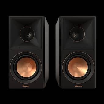 Two black speakers with copper accents on a dark background.