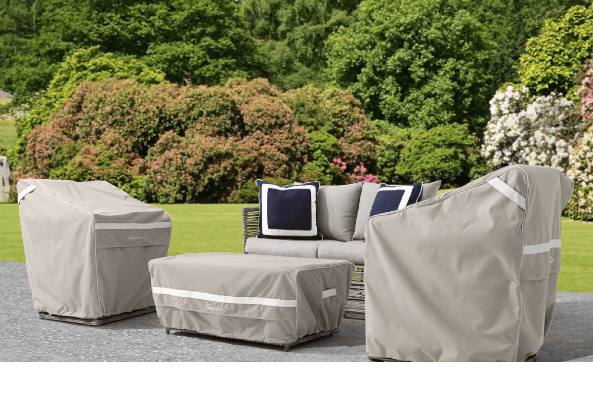 Assorted outdoor lounge furniture covered with protective fitted covers. 