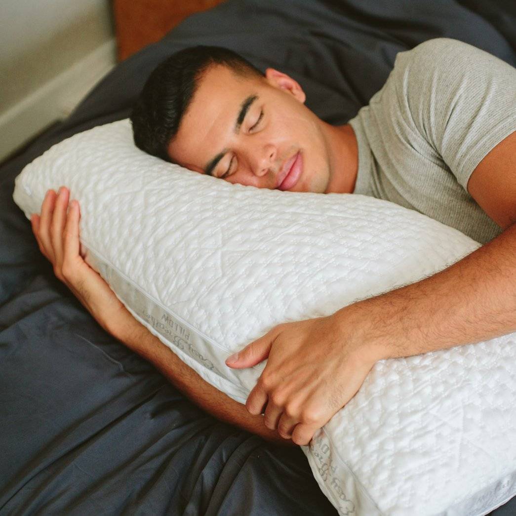 man sleeping on easy breather pillow