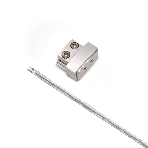 Metal clamp with two screws beside a metal rod.