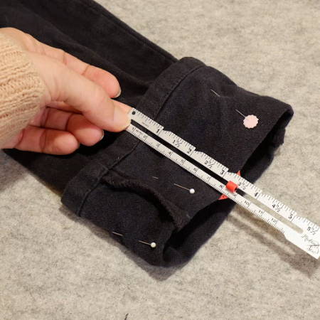 Checking hems with a seam gauge with guide