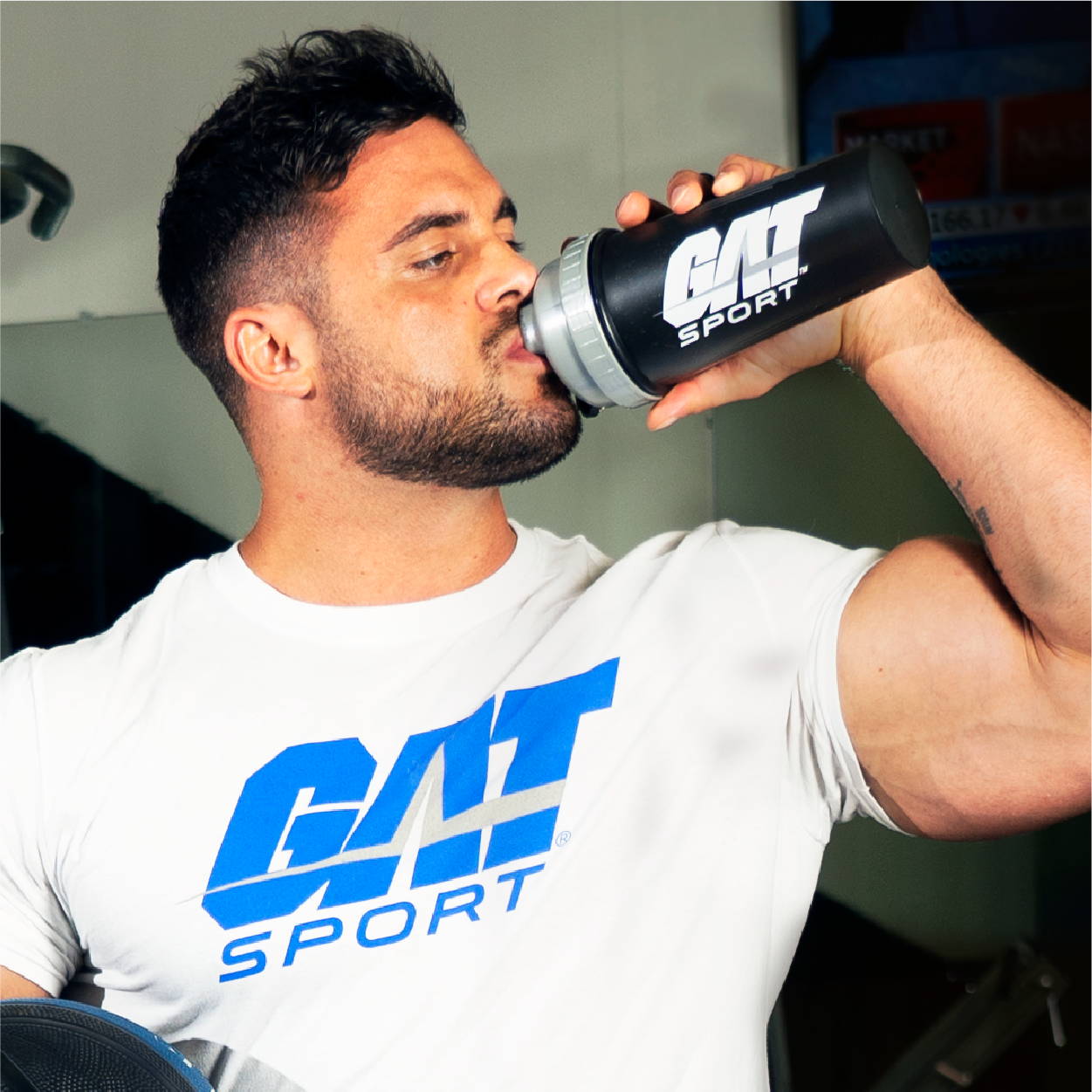 male athlete drinking Flexx EAAs with GAT Sport Shaker