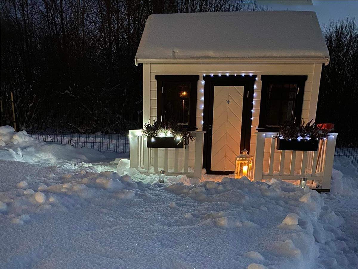 Kids Custom Wooden Playhouse With Metal Roof, White Walls,doors and Black trims   in winter By WholeWoodPlayhouses