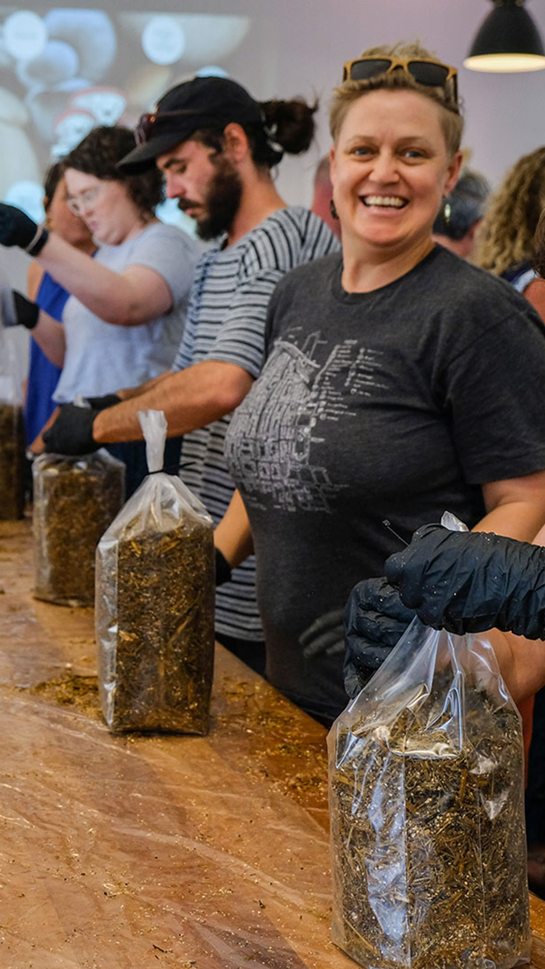 A happy workshop participant with their mushroom bag