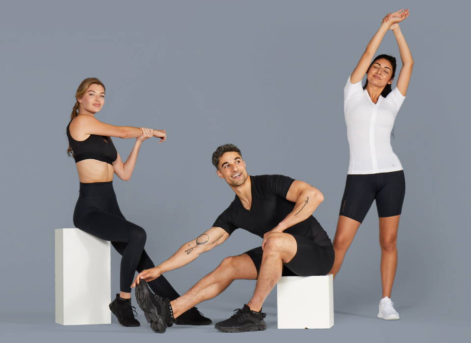 Men and women wearing Tommie Copper compression