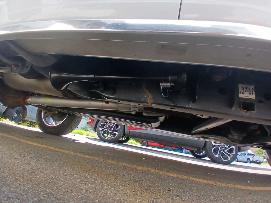 Black air horn mounted under Ford F-150