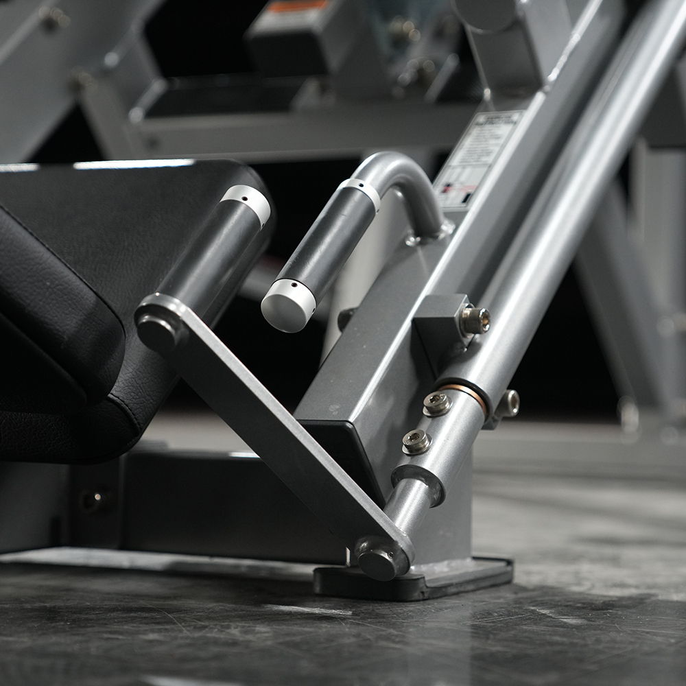 Close-up of a gym weight machine's handle and frame.