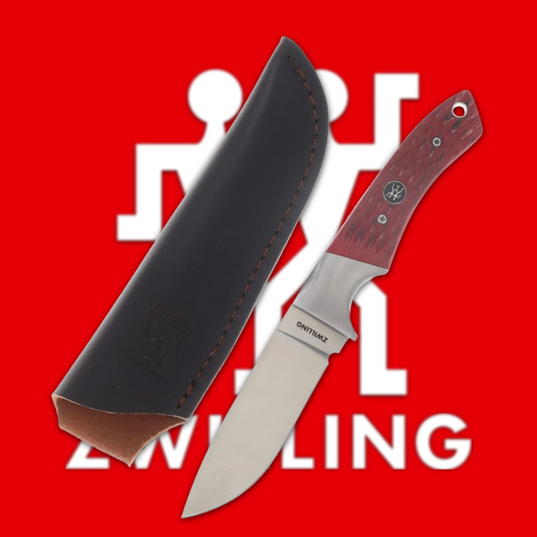 Knife with a wooden handle and leather sheath on a red background.