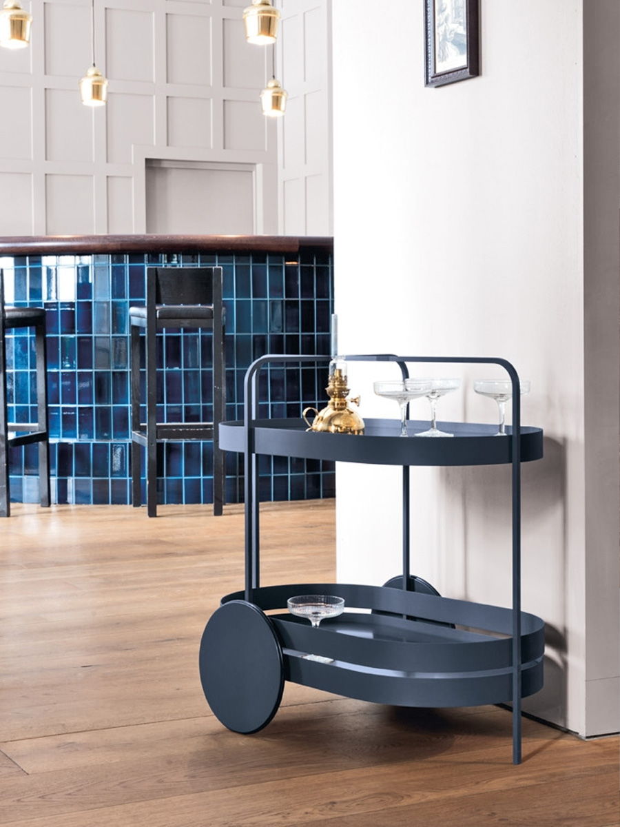 A modern Schonbuch serving cart in a stylish interior setting.