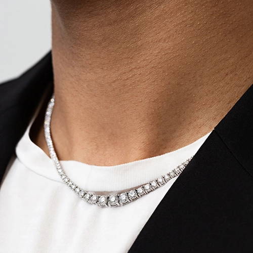 Man wearing a white gold tennis necklaces featuring lab grown diamonds by MiaDonna
