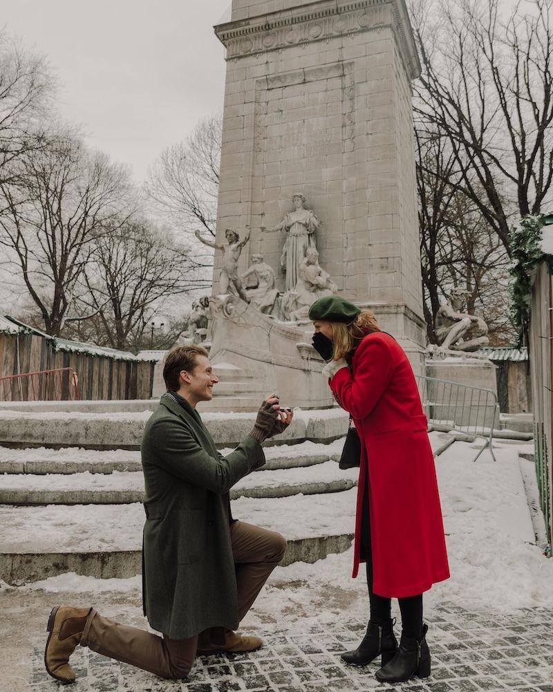 man proposing at columbus circle, wintertime