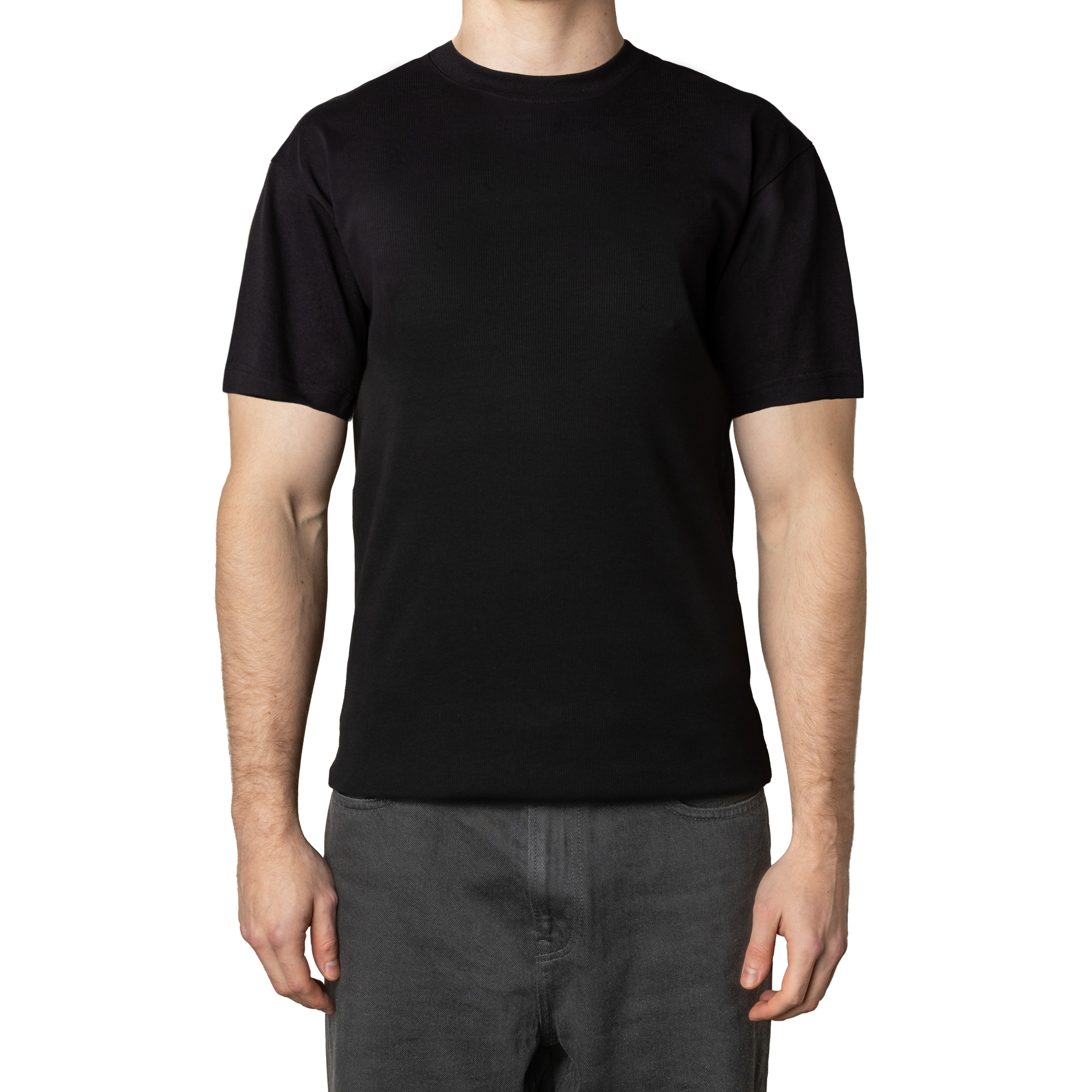 Person wearing a plain black t-shirt and gray pants, standing upright.