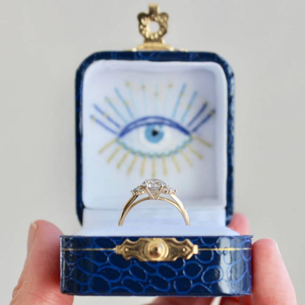 gem breakfast ring in hand embroidered evil eye woodbury and co ring box
