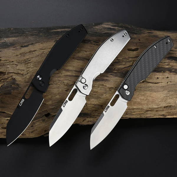 3 crb button lock knives on a log