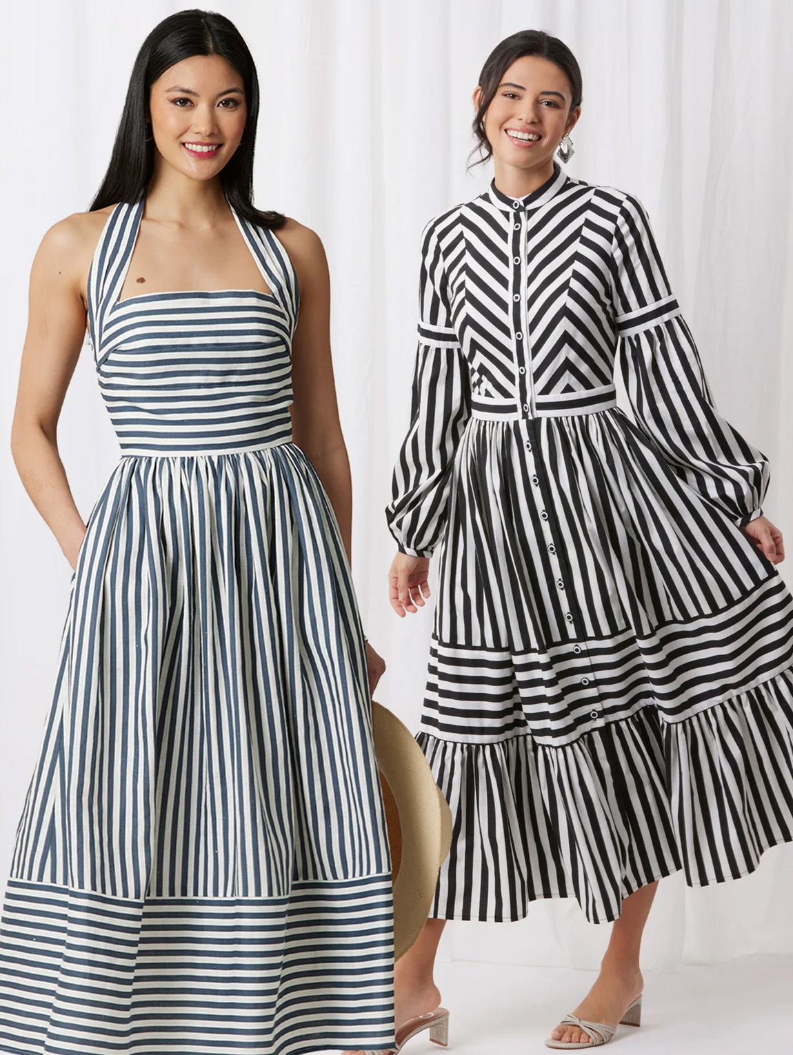 Two models wearing striped dresses in a light background.