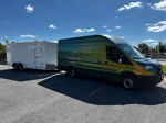 Ford Transit 350 iridescent green gold towing white enclosed trailer sunny parking lot Taylor's 228H gallery photo 2