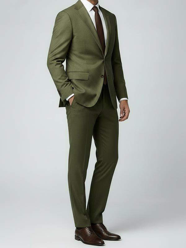 Man wearing an olive suit with a brown tie