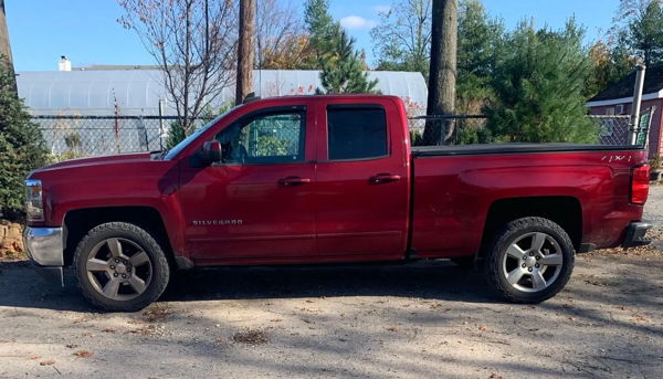Side profile red 2018 Chevrolet Silverado 1500 4x4 parked near nursery Stephen's HornBlasters Conductor's Special 244K train horn install photo 1