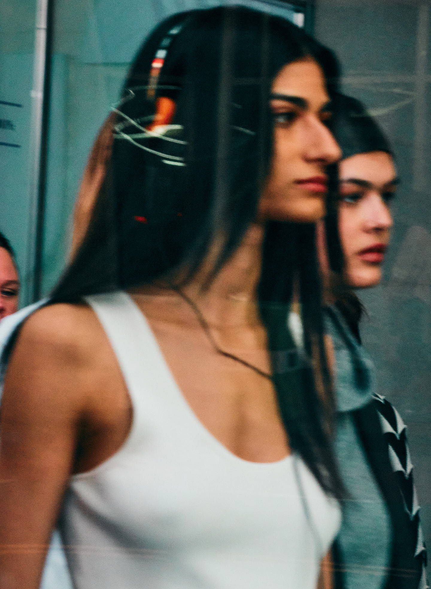 Model on NYC sidewalk with headphones
