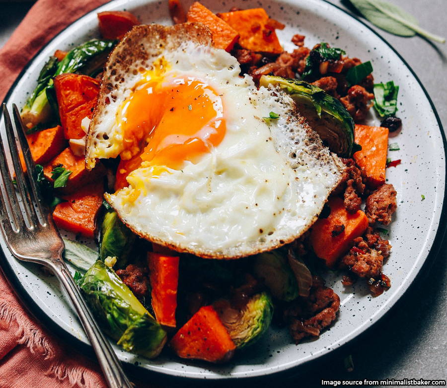 egg plated on top of sweet potato hash