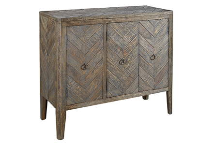 Wood storage cabinet with chevron pattern.