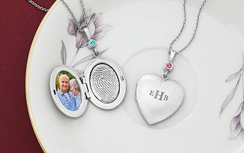 sterling silver oval and heart lockets engraved with a fingerprint on the inside