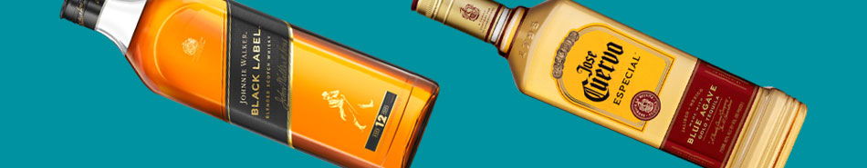 Two bottles of alcohol on a bright blue background.