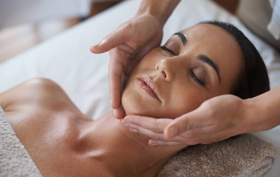 woman receiving facial massage