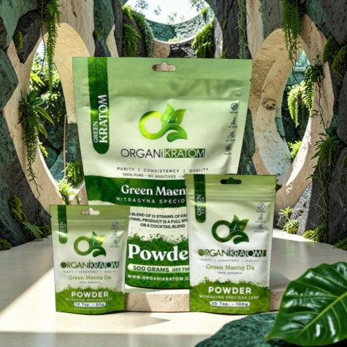 Bags of green matcha powder displayed with a natural background.