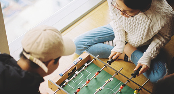 a couple playing foosball together