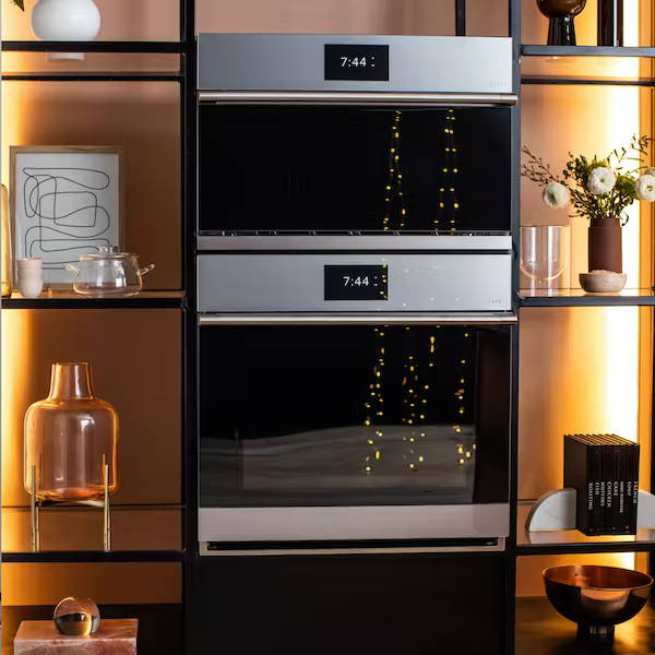 Twinkle lights reflected in wall ovens