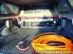 Truck bed interior black air tank dual compressors pressure gauge orange coiled air hose blow gun bed liner camper shell Dennis's 2000 Tundra Nathan Airchime K5 onboard air gallery photo 3