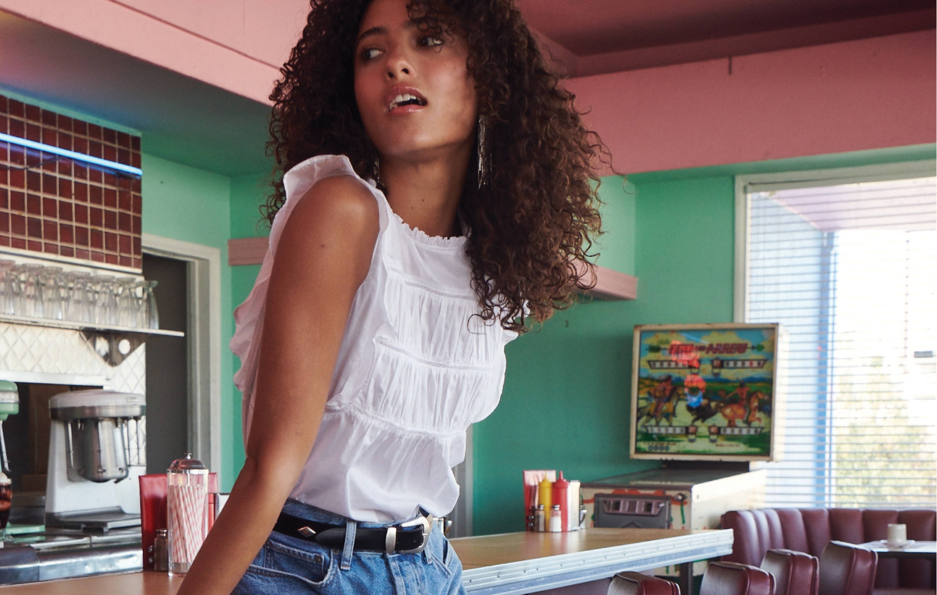 Model in diner wearing Filomena shirt in white - image 2