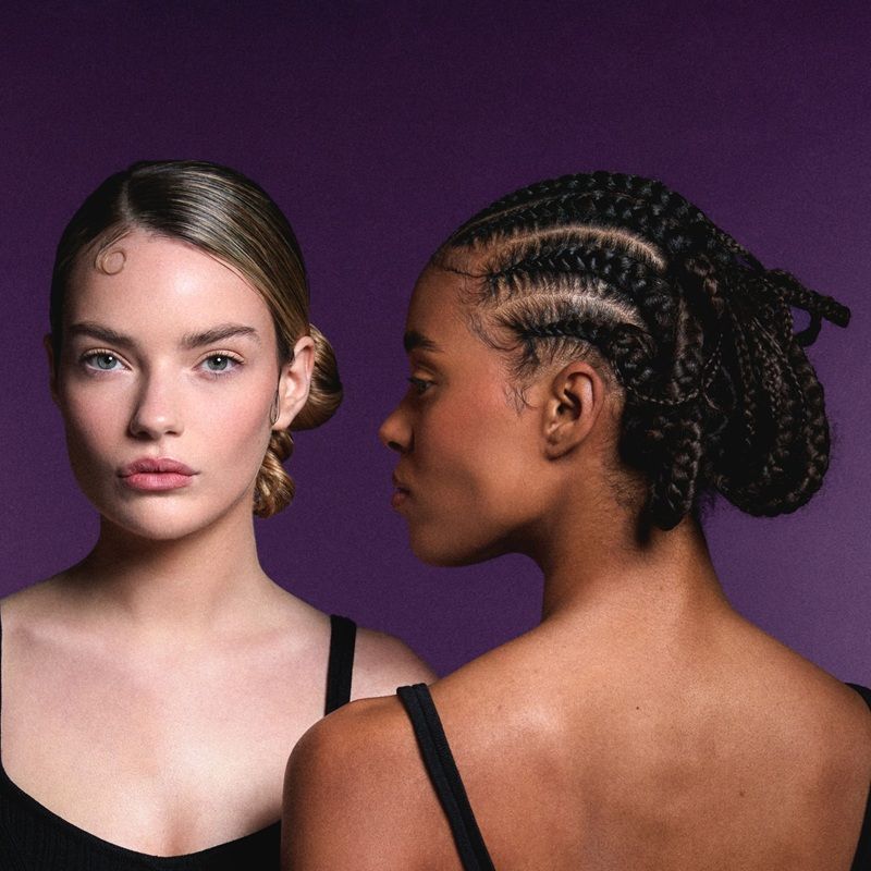 Two women with different hairstyles against a purple background.