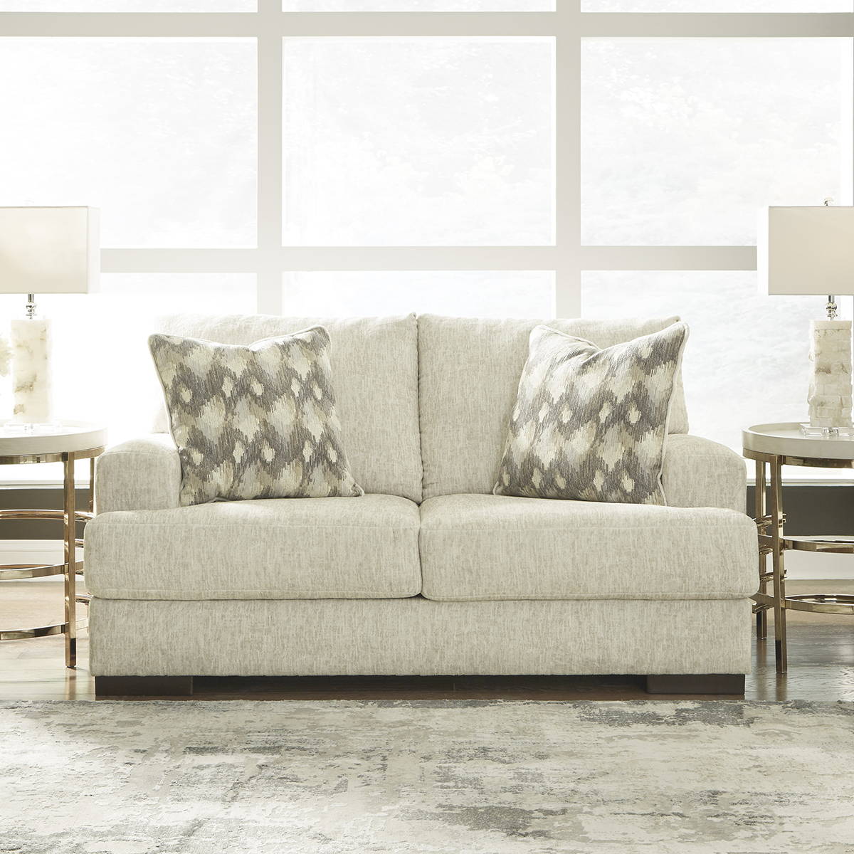 Ashley Off-White Loveseat with Matching Pillows in a Living Room. Shop Loveseats Now!