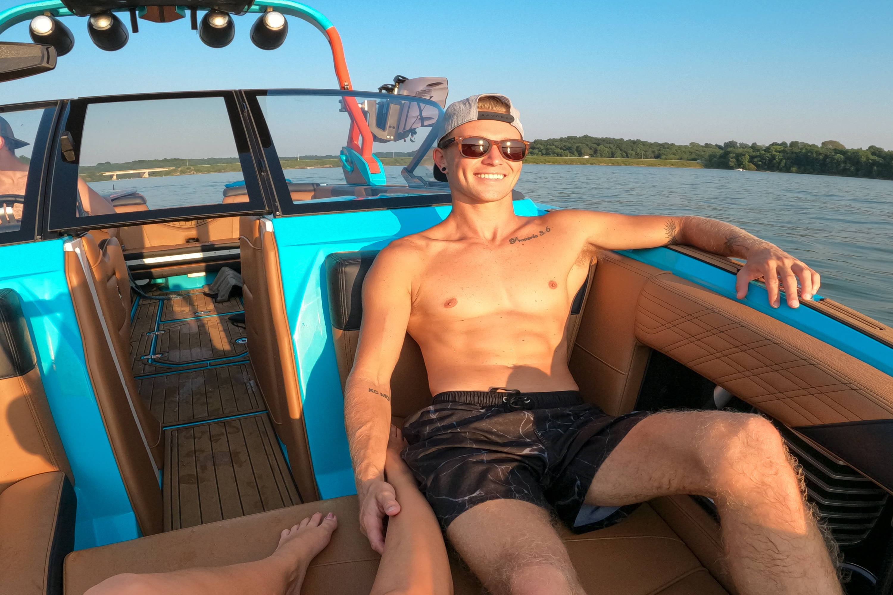 Man on a boat wearing tortoiseshell sunglasses