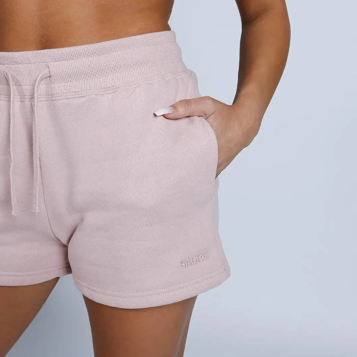 pink sacre fleece shorts on model