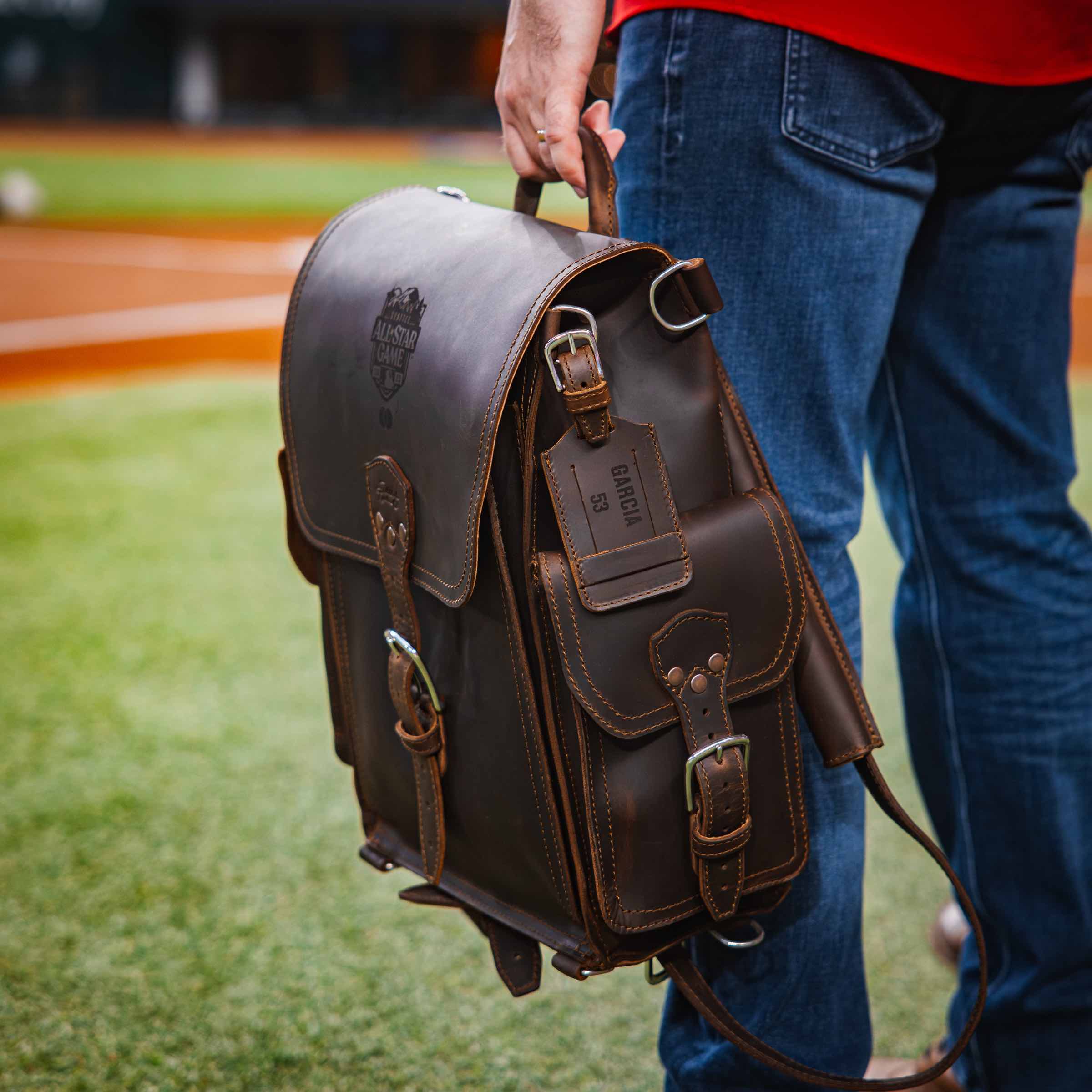 Dark Brown Tank Leather Backpack and Leather Luggage Tag.