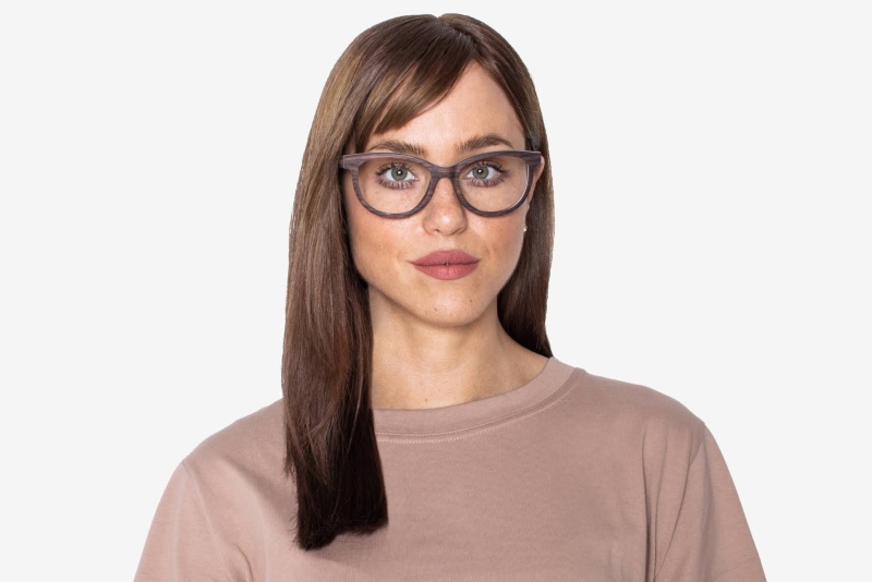 woman wearing Charm Purple, cat-eye wooden glasses frames, on a white background