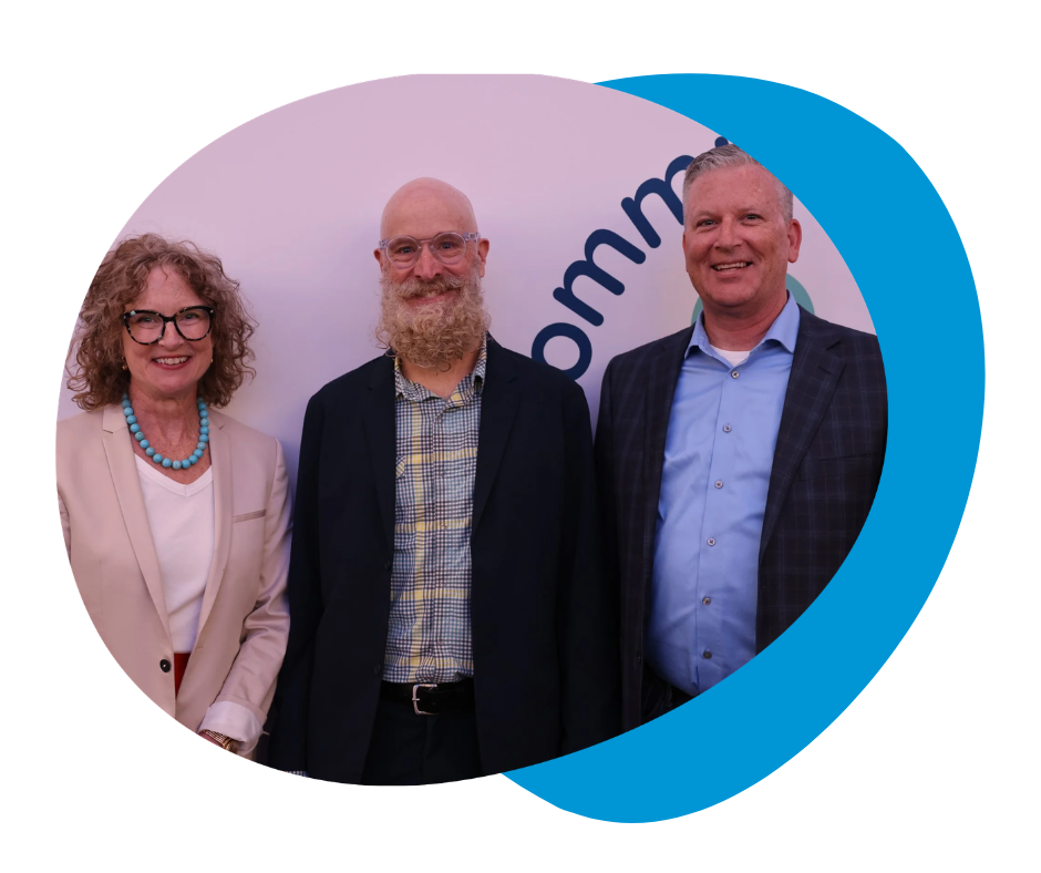 Kate Dunning, Matt Dunning, and Marty Gallagher smiling in front of white backdrop.