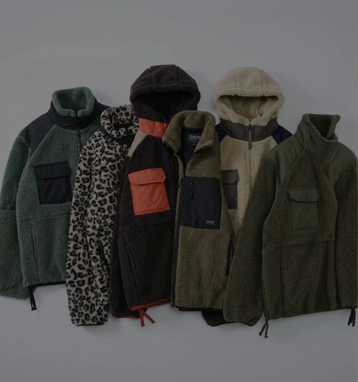 Five different styles of fleece jackets displayed on a neutral background.